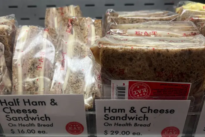 A regular "half" ham and cheese goes for $16.